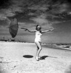 1949_tobey_beach_by_dedienes_umbrella_red_030_1