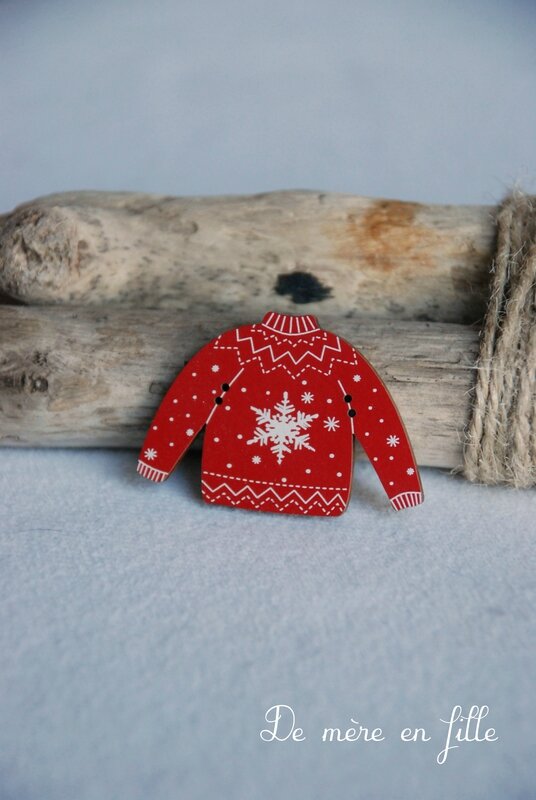 pull rouge motif ivoire