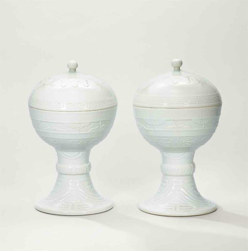 A pair of white-glazed altar vessels, dou, Guangxu incised six-character marks in a line and of the period (1875-1908)