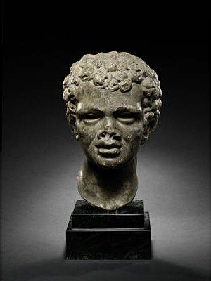 A_Roman_dark_grey_marble_portrait_head_of_an_African_youth_1