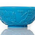 A blue-turquoise-colored Beijing glass bowl with carved buddhist scene, China, 19th century. photo courtesy Nagel