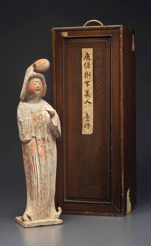 A painted red pottery figure of a standing court lady,Tang dynasty (AD 618-907)