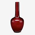 A Chinese pear shaped ruby red glass vase, Qianlong four character wheel-cut mark within a square and of the period