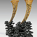 A pair of large reticulated rhinoceros horn libation cups, 19th century