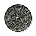 A bronze circular mirror with inscription, china, late western-early eastern han dynasty, 1st century bc-1st century ad