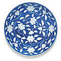 A rare reverse-decorated powder-blue 'gardenia' dish, yongzheng mark and period (1723-1735)