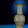A rare Longquan celadon moulded trumpet-necked baluster vase, Yuan-Ming dynasty, 14th century