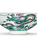 A fine and rare doucai conical 'dragon' bowl, yongzheng seal mark and period (1723-1735)