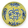 A rare underglaze-blue yellow-ground 'gardenia' saucer dish, Zhengde six-character mark and of the period (1506-1521)