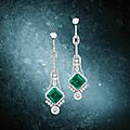 An early 20th century pair of fine emerald and diamond pendent earrings, circa 1920