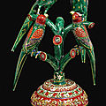 Four gold and polychrome enamelled parrots perched on a branch, north india, 19th century