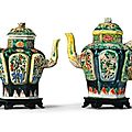 A pair of 'famille noire' biscuit ewers and covers. qing dynasty, kangxi period