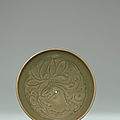 A Yaozhou carved celadon 'Peony' conical bowl, Northern Song Dynasty, (960-1127)