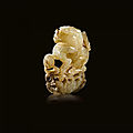 A jade carving of a lion on lotus, tang dynasty (618-907)