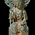 A rare inscribed gilt-bronze figure of avalokitesvara, sui dynasty (581-618)