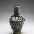 Vase, painted gold on indigo ground, with revolving interior with swimming fishes design in fencai overglaze enamel, Jingdezhen ware, Qing dynasty, Qianlong era (1736–1795). National Palace Museum, Taipei.