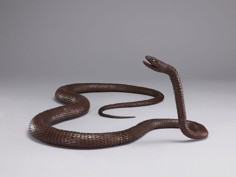 An iron articulated sculpture of a long snake, Early 20th century