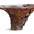A rare rhinoceros horn 'landscape' libation cup, 17th century