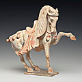 A painted pottery figure of a prancing horse, Tang dynasty (618-907)