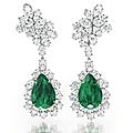 A pair of emerald and diamond ear pendants, by harry winston.