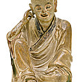 A fine stoneware figure of arhat nagasena, china, late song-early ming dynasty
