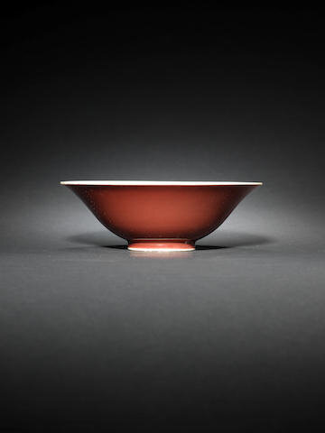 A red-glazed flaring bowl, Qianlong seal mark and of the period (1736-1795)