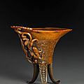 A fine and rare carved rhinoceros horn libation cup