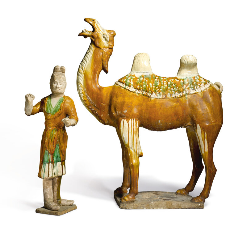 A large sancai-glazed pottery figure of a camel and groom, Tang dynasty (618-907)