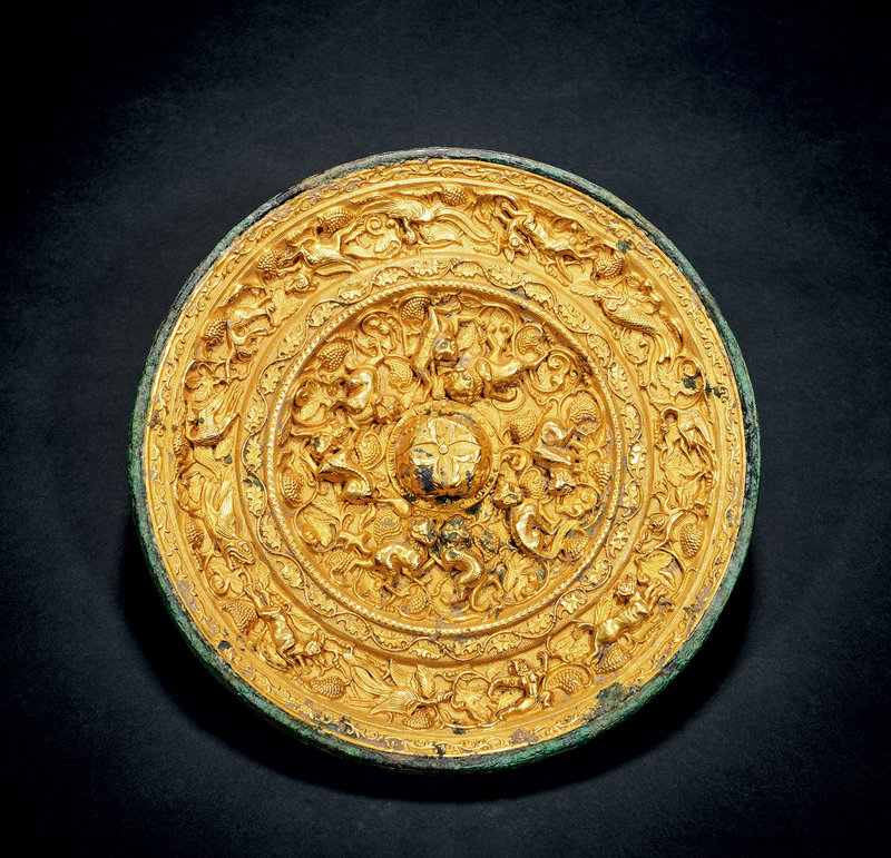 A copper gold-inlaid 'beasts' mirror, Tang dynasty (618-907)