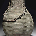 A bronze ritual wine vessel and cover, hu, late warring states period, 4th-3rd century bc