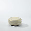 A small white-glazed circular box and cover, Tang dynasty (618-907)