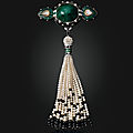 An art deco emerald, diamond, ruby and enamel shoulder brooch, cartier