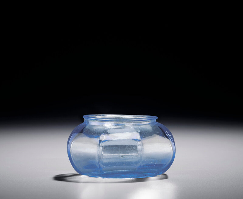 A transparent blue glass octagonal water pot, Qianlong incised four-character mark within a square and of the period (1736-1795)