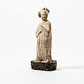 A Chinese pottery figure of a fat lady, Tang dynasty (618-907)