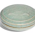 A rare moulded 'longquan' celadon box and cover, song dynasty
